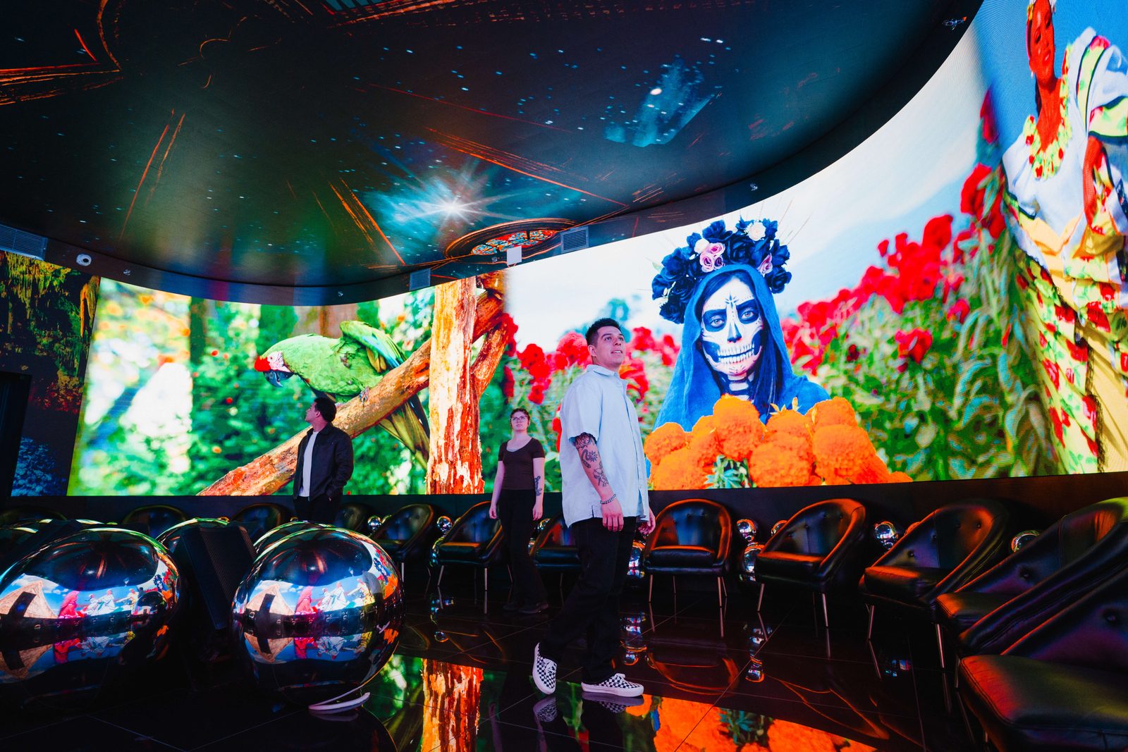 Visitors in front of a curved LED wall at Colors of Mexico, Las Vegas